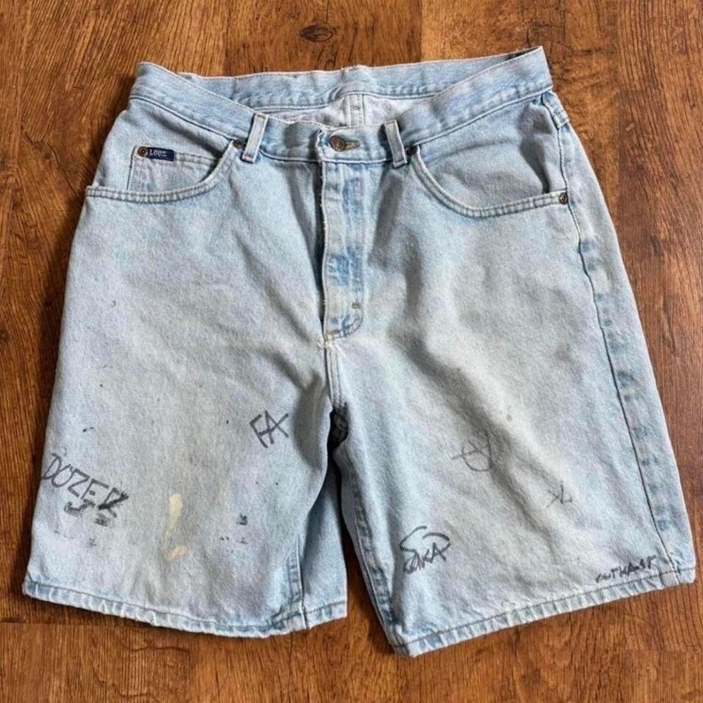 Lee blue denim shorts with paint marks and writing, ultra faded